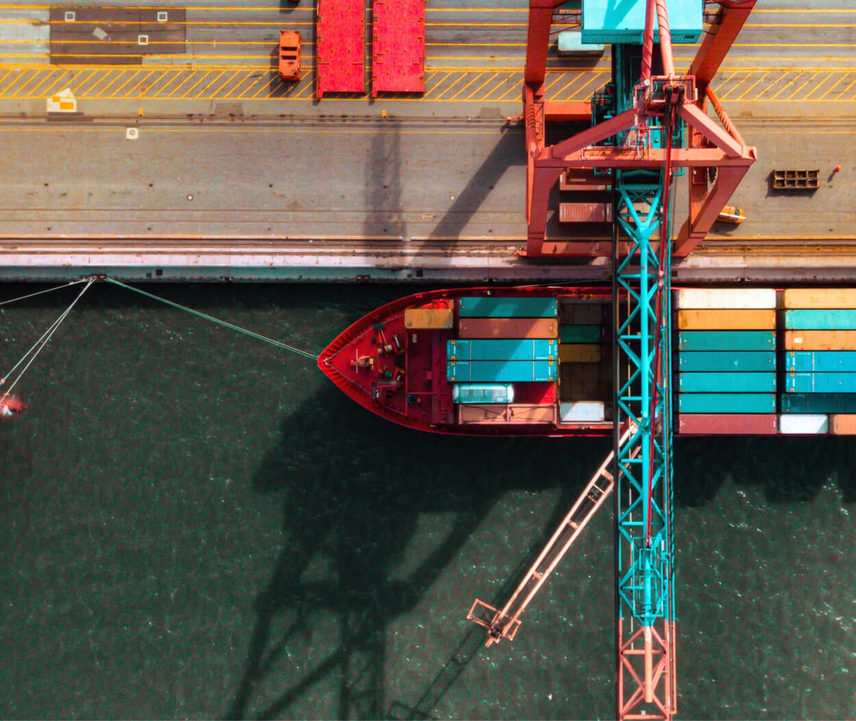 Aerial view of a container crane and a cargo ship